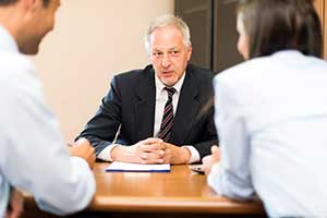 Fairfax banker speaking to potential clients about cds